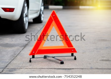 Hazard warning safety triangle sign for car.