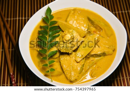 Thai King or Barracuda fish curry with coconut milk mild spicy seafood cuisine, Thailand. Rice and fish is a popular delicious recipe in the Indian coastal area restaurant. 