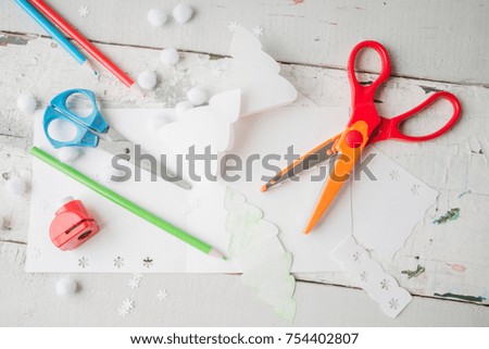 Hand made Christmas cards out of paper, scissors, snowflakes