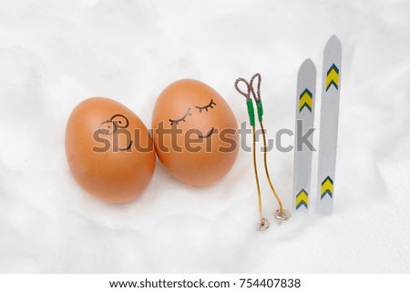 Funny lovely eggs with ski in snow.