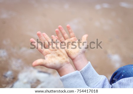 hands child sand