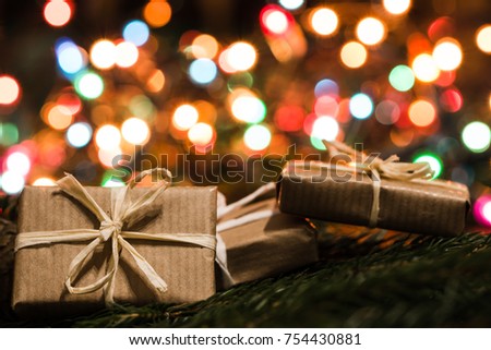 Christmas eve background, vintage gift boxes and lights in blurred colors