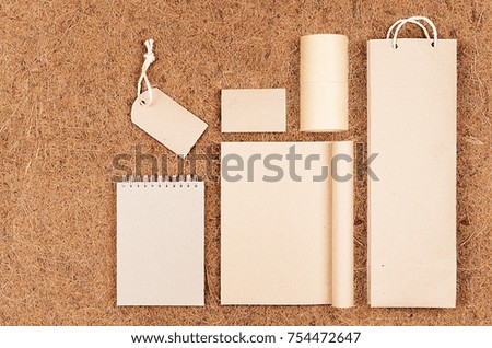 Template of blank kraft recycled paper packaging and stationery on brown coconut fiber background. Mock up for branding, advertising, design.