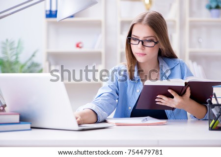 Young teenage female student preparing for exams at home Royalty-Free Stock Photo #754479781