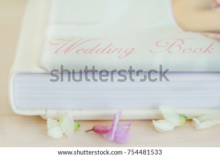 Blurred picture album. Wedding album Family symbol of marriage. Photo book with flowers. Selective focus.