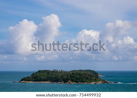 Scenic View Seascape of Island with Buddha Statue with Beautiful Cloudy in Blue Sky Day. Cloudy Day in Phuket. Scenic View of Andaman Sea Phuket, Thailand. Long Exposure Seascape.