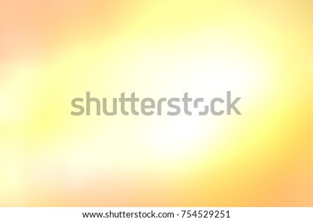 Gold abstract bokeh background. Colorful abstract blurred autumn background. Background of gold light.
