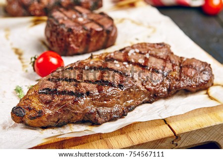 Gourmet Grill Restaurant Steak Menu - New York Beef Steak on Wooden Background. Black Angus Prime Beef Steak. Beef Steak Dinner. Top VIew