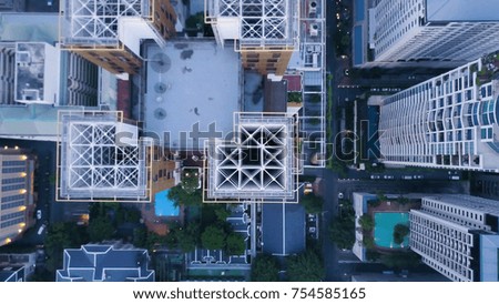 Top view of modern town with skyscrapers. Aerial of an amazing landscape on a city with modern skyscrapers and enterprises. Top view on a developed town with office buildings and advanced