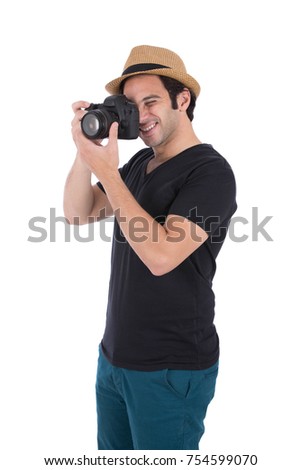 Cheerful caucasian man taking some moments by his camera. Isolated on white background.