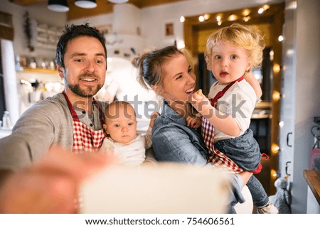 Young family making cookies at home.