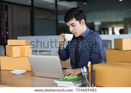 Asian Businessman drinking coffee while working at office. People working concept.