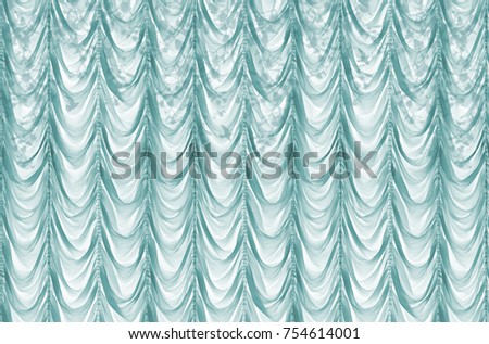 Artistic shadows on turquoise curtains