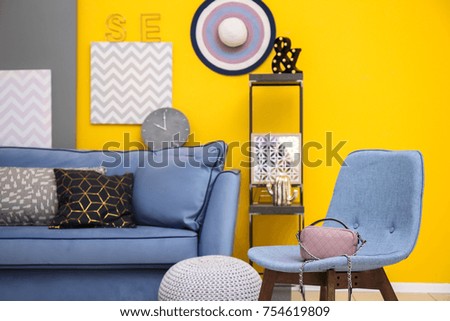 Modern interior with comfortable sofa and chair