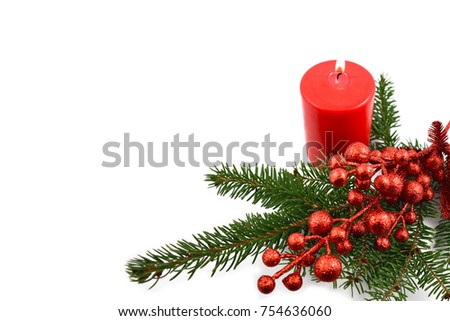 Christmas candle with spruce twig stock images. Red candle with twig. Christmas decoration photography. Red christmas decoration on a white background