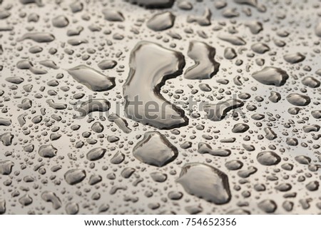 Drops of Rain or Water Drop on the Hood of the Car. Rain Drops on the Surface of the Car or on the Iron Surface Flow Down. Abstract Background and Water Texture for Design.