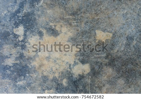 Scratched grunge grey, blue and brown concrete cement wall 