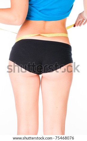 woman diet concept with measuring tape on white
