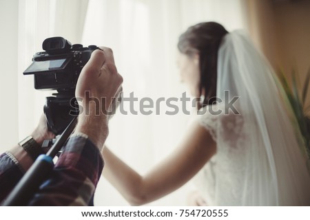 the cameraman takes off the wedding