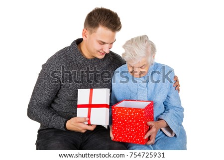 Picture of an old lady celebrating Christmas with her grandson 