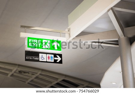 Fire exit and toilet sign in airport 