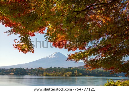 Mt. Fuji in autumn with red maple leaves at Kawaguchigo lake Japan
