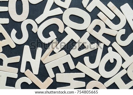 Close up wooden alphabet study english letters,ABC on the blackbroad as a background composition