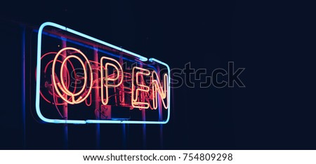 "OPEN" restaurant sign in night time with blank copy space, black background