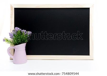 Blank chalkboard with flower decoration on white isolated background
