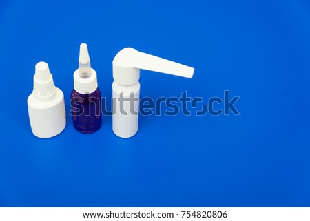 Drops, pills, lekartva and thermometer on a bright background