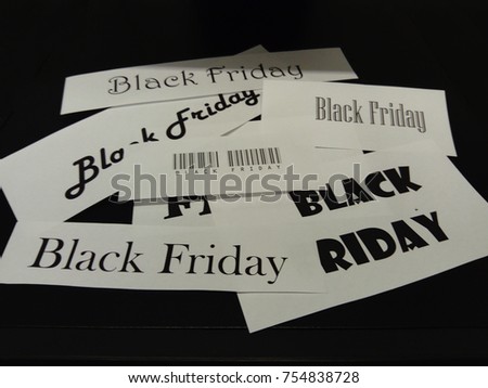 Many white cards with black letters, text Black Friday.
