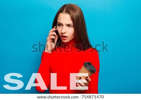 sale, black Friday, technologies,emotions, people, beauty, lifestyle concept - emotional happy beautiful woman in red blouse lovely portrait beautiful woman talking phone and holding take away coffe