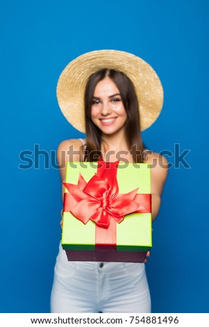 Happy woman show thumb up, hold red gift box. Business woman portrait isolated. Studio.