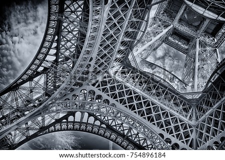 under the eiffel tower in black and white