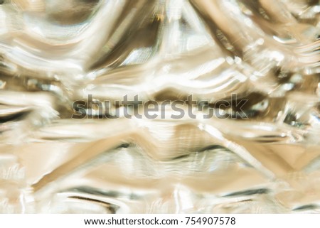Abstract representation of liquid motion on a plastic surface, macro background