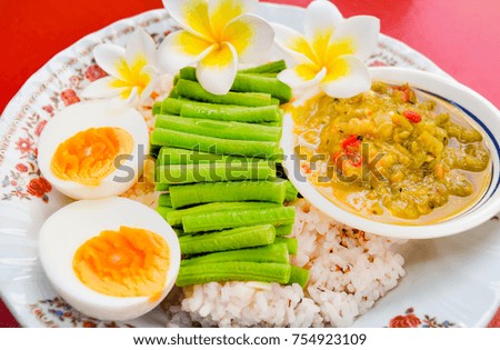 Boiled egg and long bean with chili on white plate,look tasty.