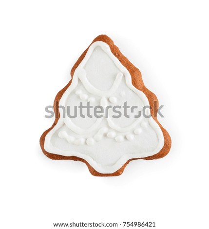 Gingerbread in the form of christmas tree - homemade sweet cookie, isolated on white background