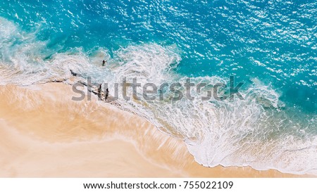 Aerial view to tropical sandy beach and blue ocean