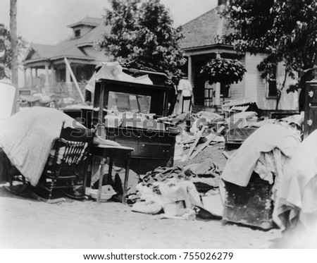 Furniture and belongings in Tulsa street during race riot of May 31 - June 1, 1921. Original caption states the owner was probably evicted during the riot. Photo by Alvin C. Krupnick Company, Tulsa, O