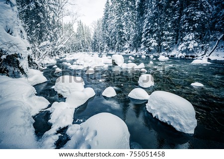 Scenic image of stormy flow. Frozen stones in frosty day. Location Carpathian, Ukraine, Europe. Great picture of wild area. Explore the beauty of earth. Incredible holiday wallpapers. Happy New Year!