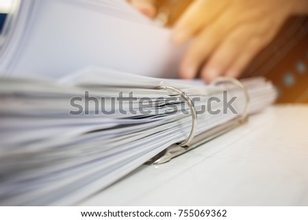 Hands business checking documents management folders in office for Annual Report files on Abstract blurred photo of businessman hands working with laptop computer. business busy concept