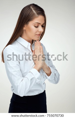 Praying woman portrait on white isolated background. Young woman christian prayer.
