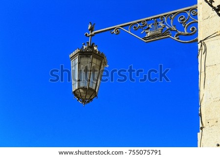 Old Lantern in the street under blue sky