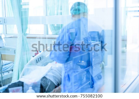 Doctor or nurse during treatment patient cancer in infectious control room.Medical care concept. Royalty-Free Stock Photo #755082100