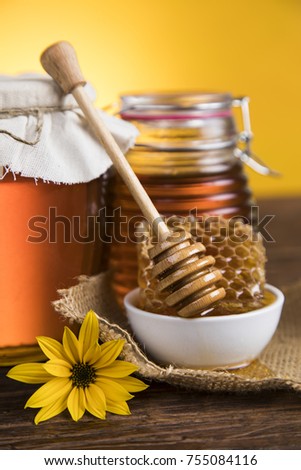 Sweet honey in the comb, glass jar
