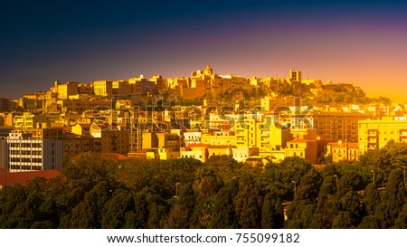 Cagliari at sunset, capital of the region of Sardinia, Italy. Beautiful skyline image of the big city on the island.
