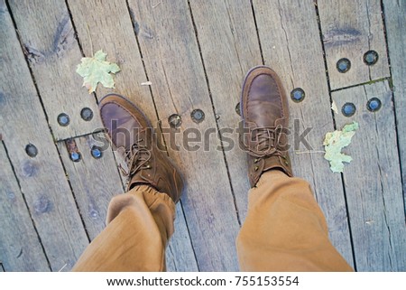 Brown Hiking Boots on Wooden Boards