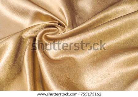 Fabric made of silk fabric metal thread metallic sheen gold. Just like looking at a stunning waterfall, this golden yellow Silk Charmeuse stands alone. Luminous and light-flowing steel metallic color