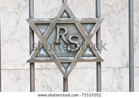 Star of David on gate of granite mausoleum - closeup. Old Jewish cemetery in California