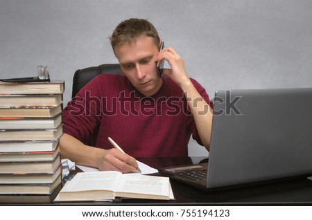 Hardworking businessman work in office and writes with pen on document page. Student studying.